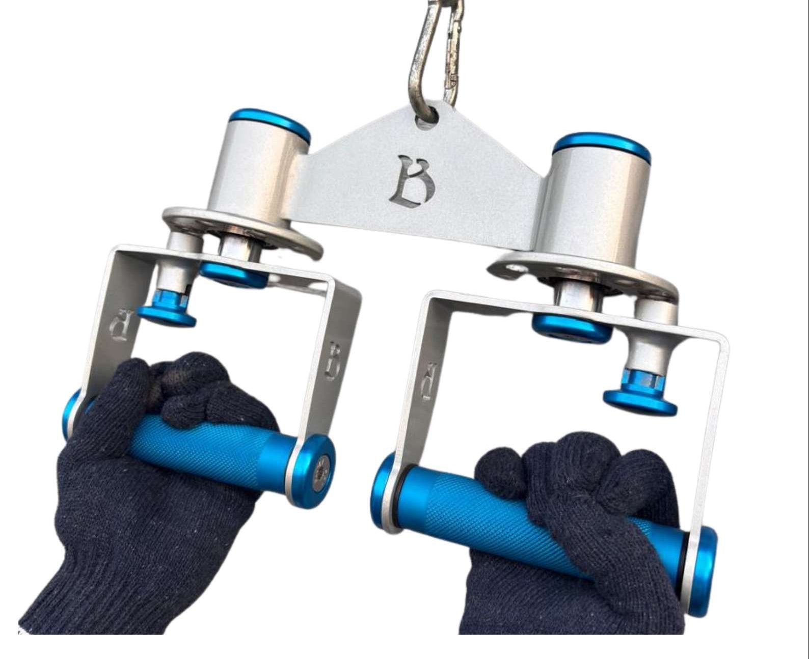 Metallic rotating grip handle attachment for various cable exercise for bodybuilding and gym. device with blue handles and a clip, held by gloved hands on a white background.