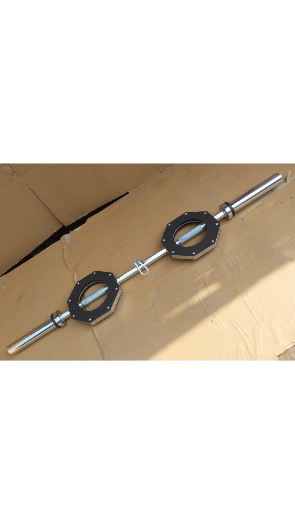 Front view of the FitMorf barbell, highlighting rotating grips and hard-chromed construction. Made by fitmorf barbarian.