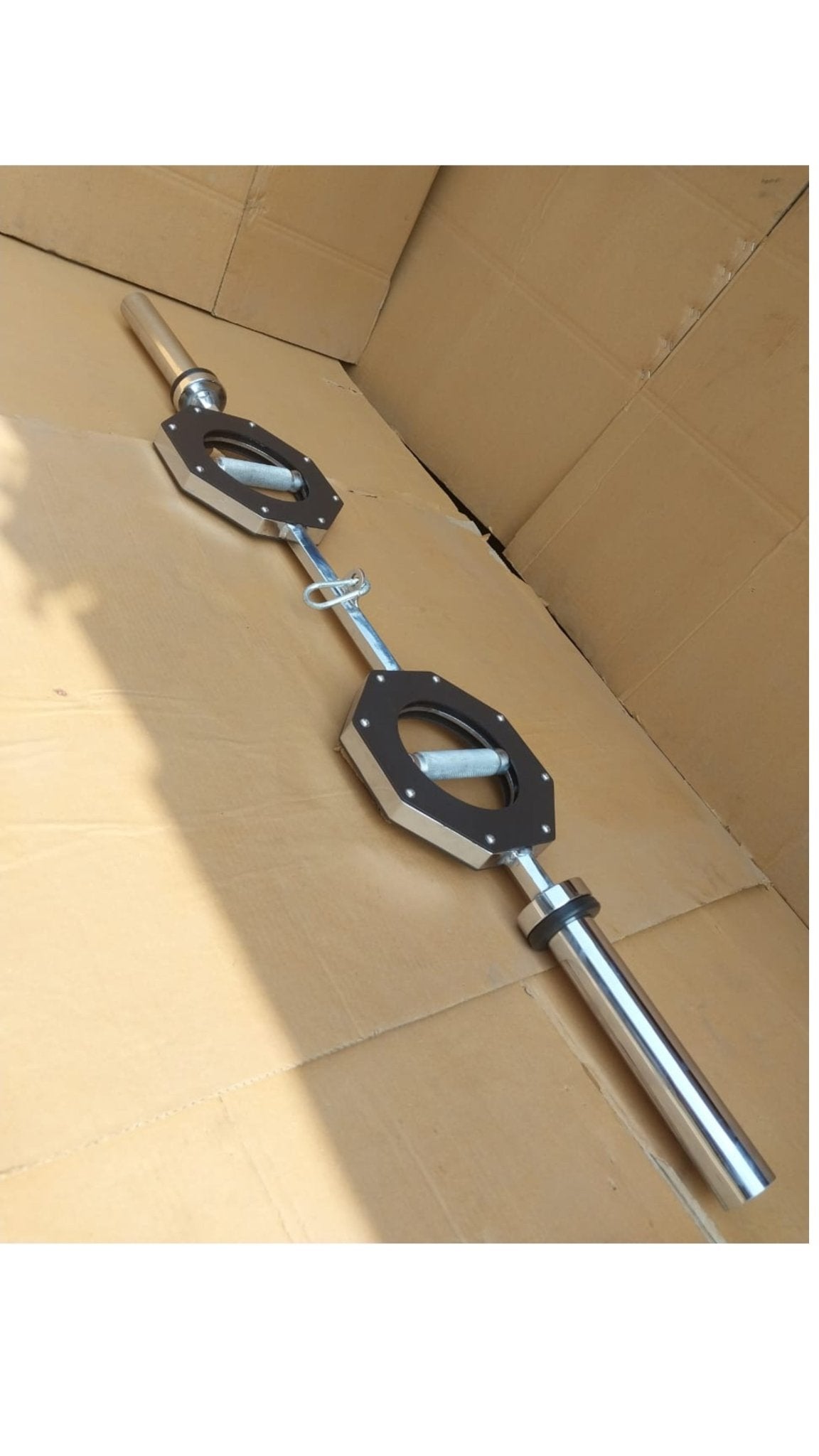 2nd Side view of the FitMorf barbell, highlighting rotating grips, cable attachment hook and hard-chromed construction